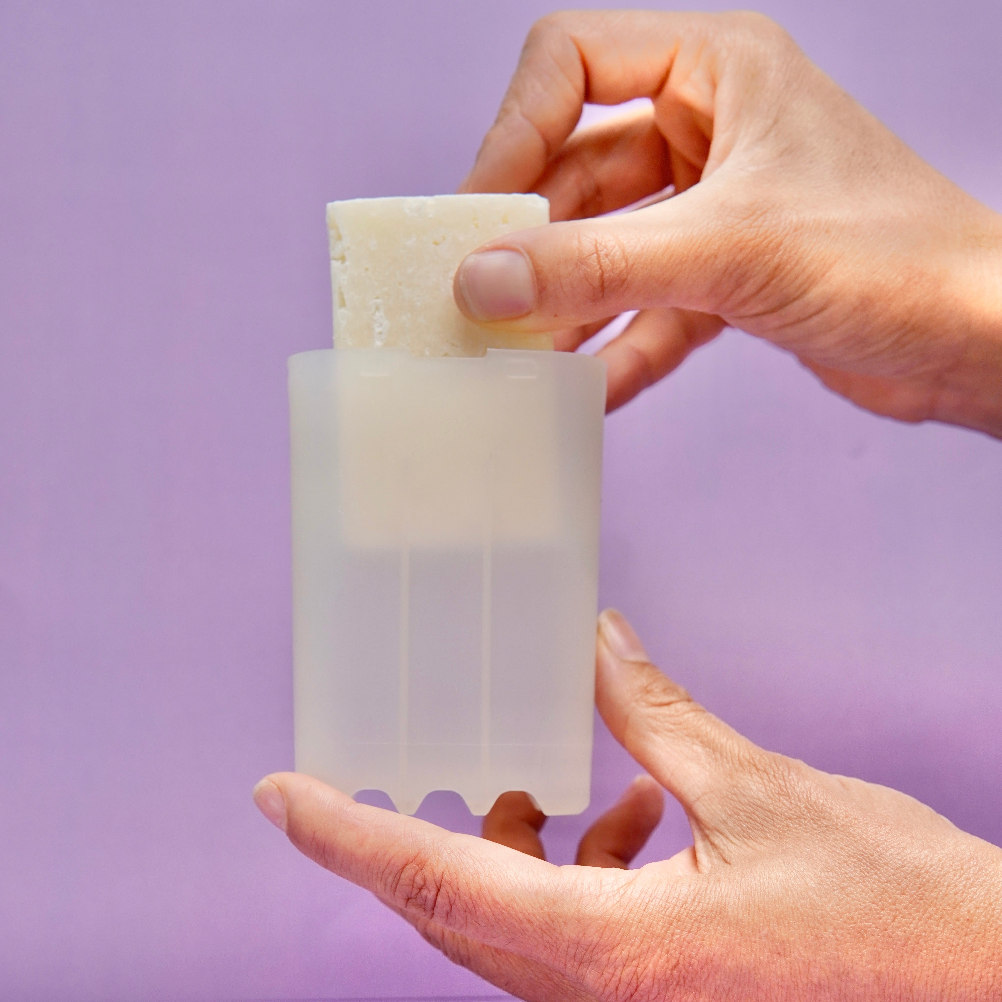 insert solid detergent bar into dispenser